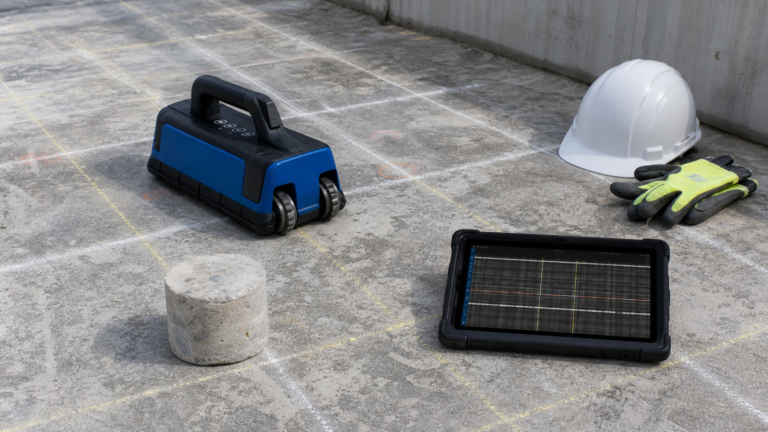 Concrete slab marked for rebar locating before concrete repair using a cover meter and GPR scanner